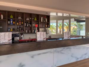 a bar at a hotel with a counter top at Luna Clube Oceano in Albufeira