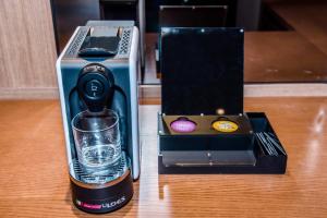 a blender with a glass in a box on a table at Dyne Oceano Hotel in Jeju