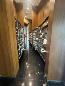 a room filled with lots of shoes on display at VORTEX Suites KLCC Premium BY RRP in Kuala Lumpur +53 photos
