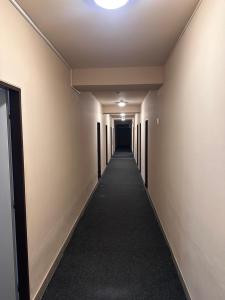 an empty corridor in an office building with a hallway at Ubytovna E75 in Mosty u Jablunkova +1 photo