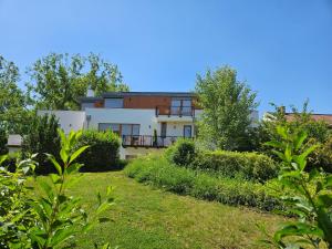 a view of a house from the garden at Platán Villa - Platán Tata in Tata