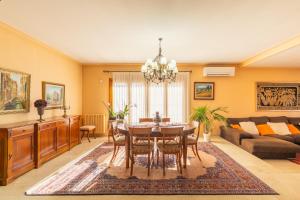 a living room with a table and a couch at Cal Ferrer Nou Costa Brava in Riumors