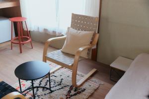 a chair with a pillow in a living room at kawasakike in Takamatsu