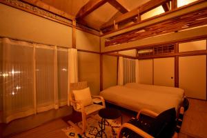 a small bedroom with a bed and a window at kawasakike in Takamatsu +23 photos