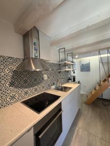 a kitchen with a sink and a counter top at Sea Pearl in Komiža