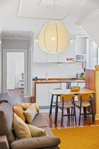 a living room with a couch and a table at Hillside - By WeHost in Funchal