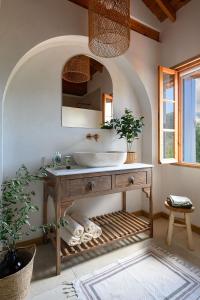 a bathroom with a sink and a mirror at Eftihia in Katouna
