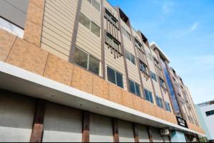 a building with many windows on the side of it at Aagaminn-A Boutique Hotel in Kota