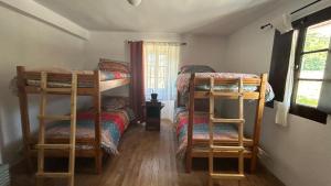 a bedroom with two bunk beds and a window at Gaia Merindades in Salinas de Rosío +2 photos