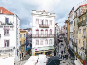 an overhead view of a city street with buildings at Casa da Portagem by PURUS in Coimbra