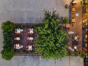 an overhead view of a restaurant with a tree at Hotel A'mare in Zadar
