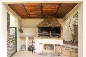 an outdoor pizza oven in a house at Majordoms Velo in Llambillas