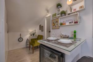 a kitchen with a counter with two glasses on it at Punta Debij Select Apartments in Punat