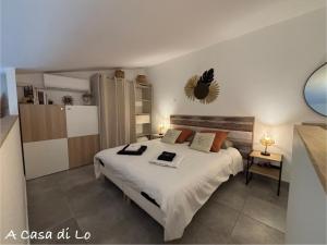 a bedroom with a large white bed in a room at Villa A CASA DI LO in Lecci +33 photos