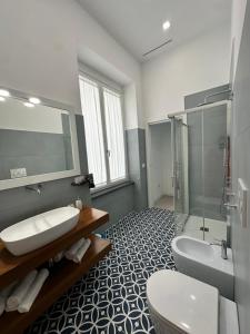 a bathroom with two sinks and a shower and a toilet at I Colori della Bellezza in Gragnano