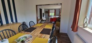 a dining room with a table and chairs in a room at Michel-Inn-Your Scandinavian Escape! in Faggemåla