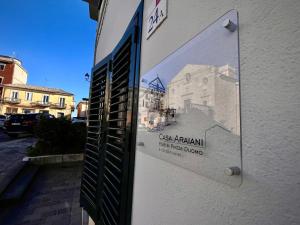 a sign on the side of a building at Casa Araiani in Ariano Irpino +3 photos