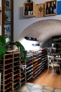 a wine cellar with a large wall of wine bottles at Il noceto dell'Etna in Giarre