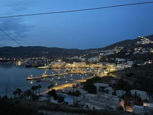 a view of a harbor at night with a city at Artistic Villa Aqua Ios in Ios Chora +14 photos