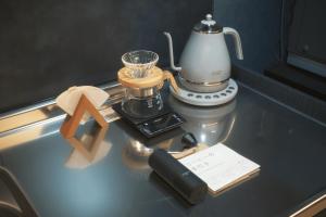 a counter top with a coffee maker and a blender at Amu in Beppu
