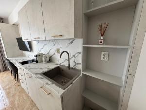 a kitchen with a sink and a counter at VP Onyx Apartment in Elenite +14 photos