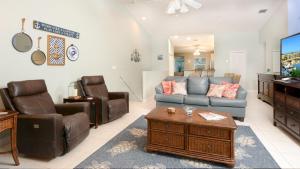 a living room with a couch and a tv at 802 Mariners Club in Key Largo