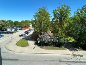 an aerial view of a parking lot with cars at Welcome Valmiera in Valmiera