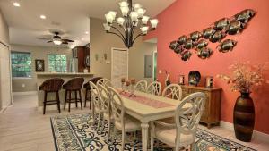 a dining room and kitchen with a table and chairs at 808 Mariners Club in Key Largo