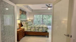 a bedroom with a bed and a window at 808 Mariners Club in Key Largo +44 photos