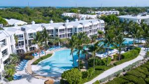 an aerial view of a resort with a pool and palm trees at 808 Mariners Club in Key Largo