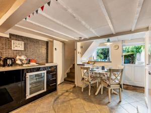 a kitchen with a table and a dining room at 2 Bed in Brixham oc-bx021 in Brixham