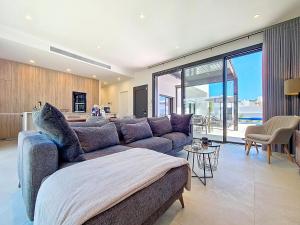 a living room with a couch and a large window at Casa Colisa - 8610 in San Javier