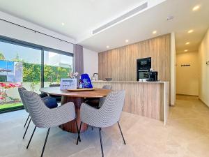 a dining room with a table and chairs in a kitchen at Casa Colisa - 8610 in San Javier