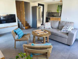 a living room with a couch and a table at my suite home in Heraklio