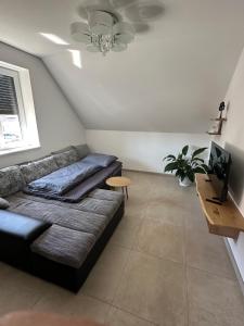 a living room with a couch and a table at Kiefer in Nortrup