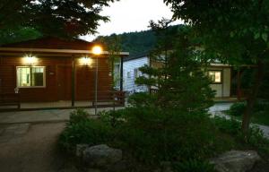 a house with a light in front of it at Pocheon Haneulbat Pension in Pocheon +12 photos