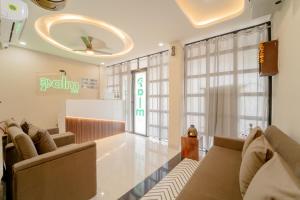 a waiting room at a clinic with couches at palm hotel mansarovar in Jaipur