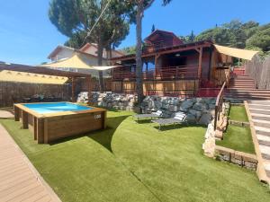 a house with a pool table in the yard at NEW Family Villa ideal para familias in Pineda de Mar