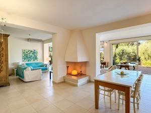 a living room with a table and a fireplace at Approdo in Ortona