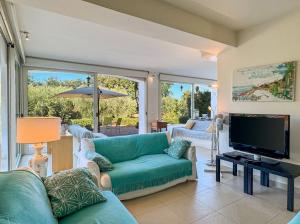 a living room with a couch and a television at Approdo in Ortona +17 photos