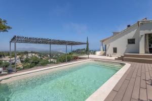 a swimming pool in the backyard of a house at Sa Punta 99 F2 in Begur