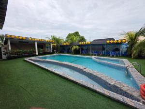 a large swimming pool in a resort at Trev Hotels and Suites in Asaba