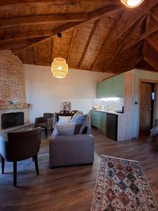 a living room with a couch and a table at Ξενώνας Ίταμος in Kato Trikala Korinthias