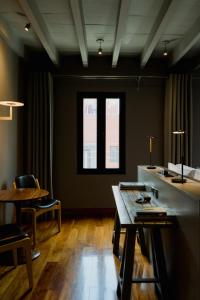 a room with a table and chairs and a window at Dos Casas Hotel & Spa in San Miguel de Allende
