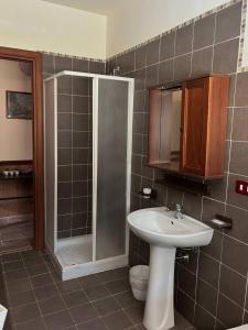 a bathroom with a sink and a shower at Tenuta Seredipà in Castellammare del Golfo +26 photos