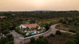 an aerial view of a house with a road at Quinta das Amendoeiras B&B in Nora