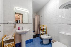 a bathroom with a sink and a toilet at Tu Descanso en Ohanes in Ohanes +20 photos