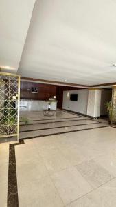 a large room with a stage and a television at فندق فاتوران فرع ينبع in Yanbu