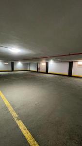 an empty parking garage with lights on at فندق فاتوران فرع ينبع in Yanbu