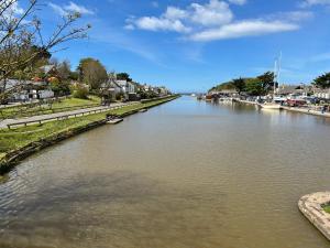 a view of a river with boats in it at Bithecutt Cottage in Bude +14 photos